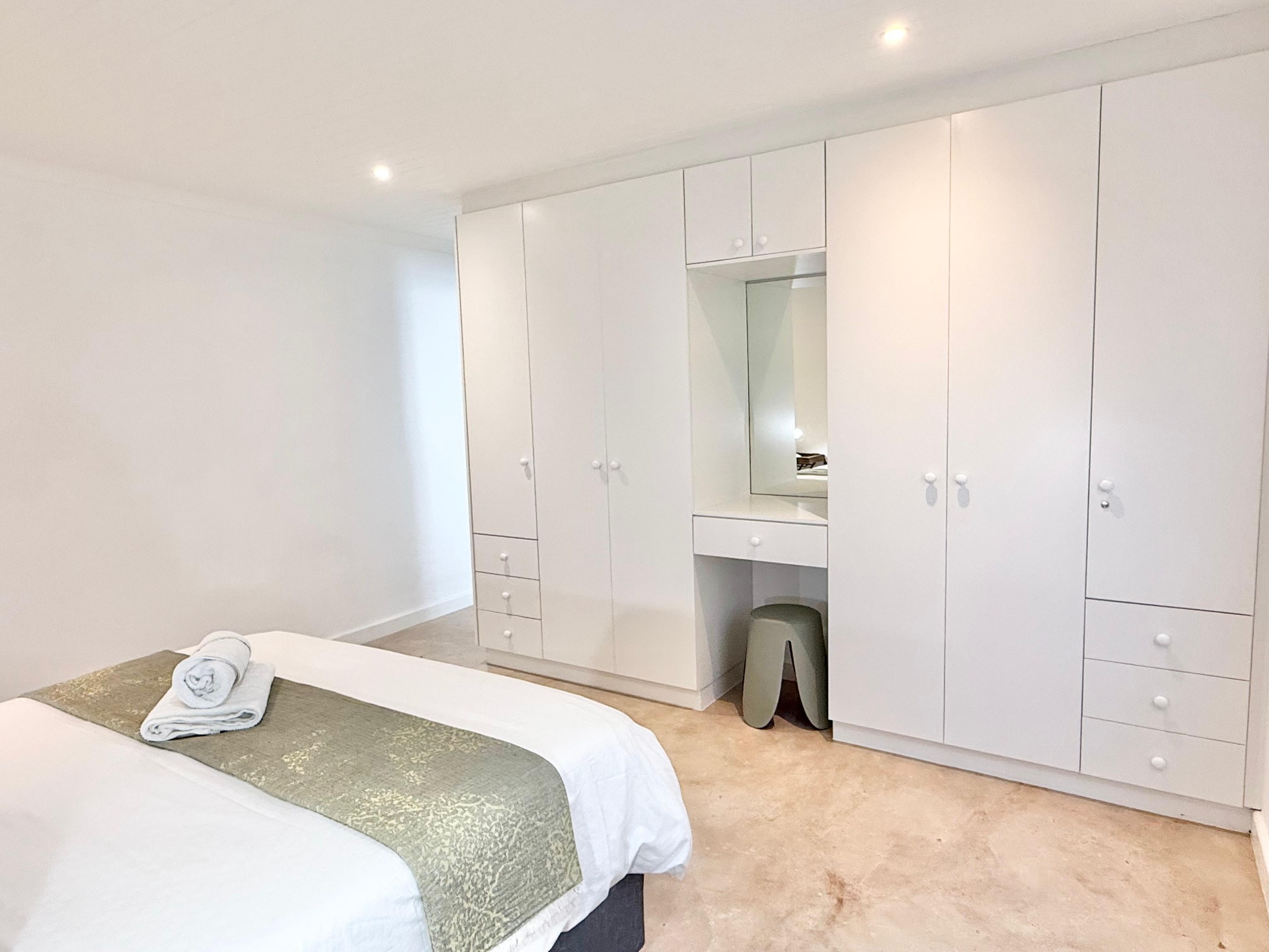 Second bedroom with fitted wardrobes and vanity