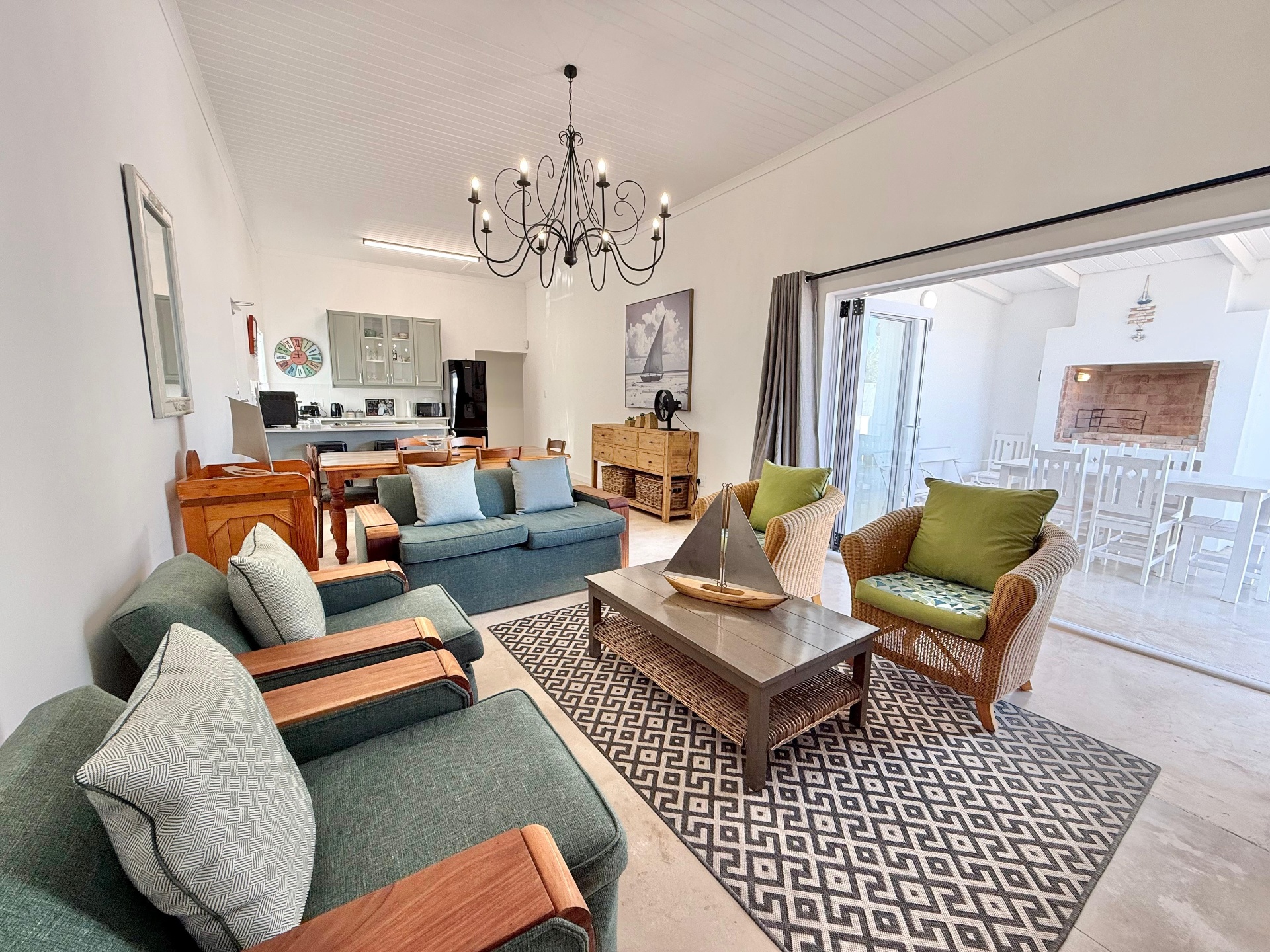 Open-plan living and dining room with chandelier